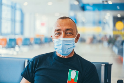 Man wearing a mask in an airport 